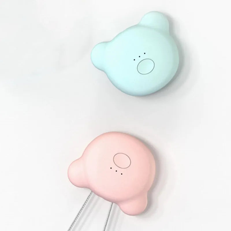 Mini USB portable air purifier necklace in pink, showing compact design with a wearable collar.