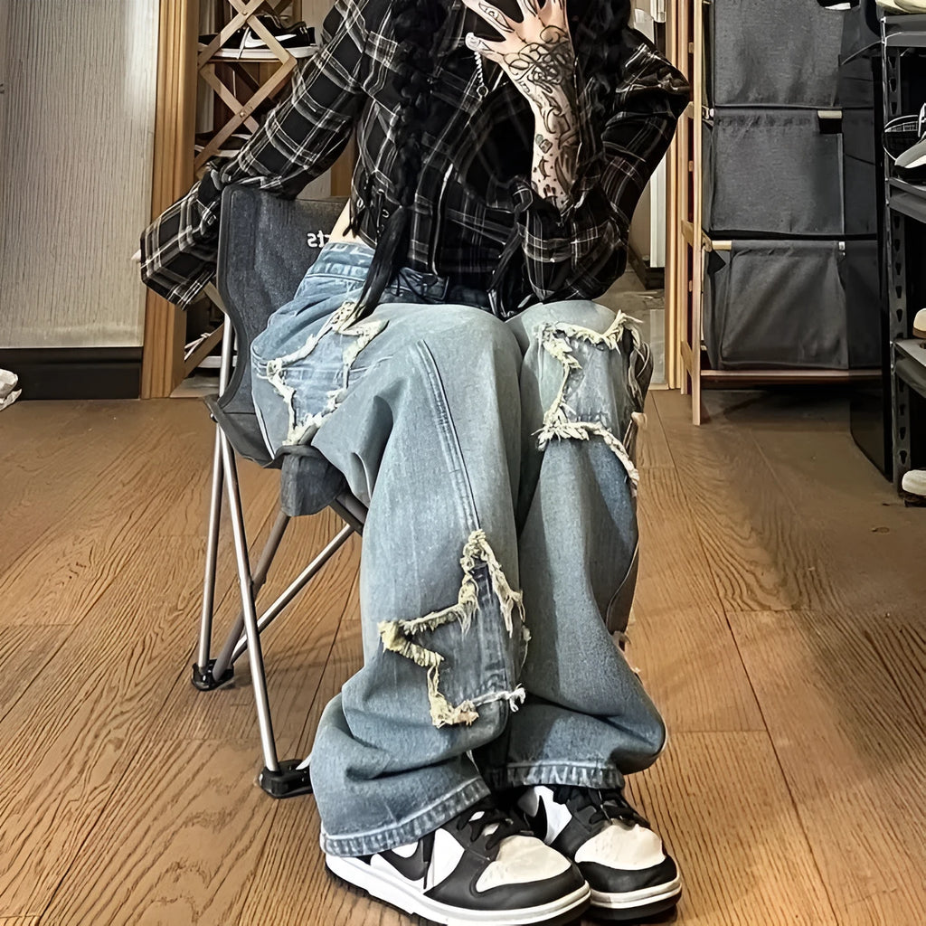 Blue women's straight-leg jeans with a high waist on a hanger, showing the denim texture and cut.