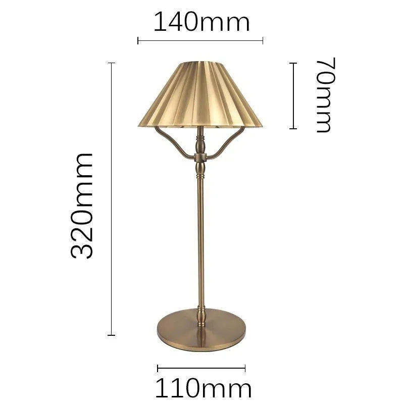 Gold-coloured alloy desk lamp with a fabric lampshade, showing a USB Type-C charging port.