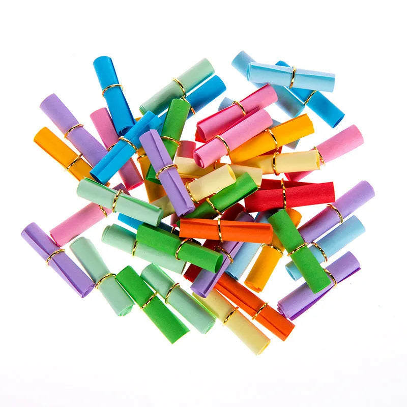 Assorted colourful paper scrolls with metal eyelets for messages and craft projects.