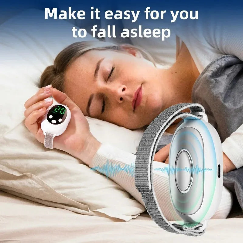 White sleep aid instrument with handheld remote control and wearable bracelet on a charging cable.