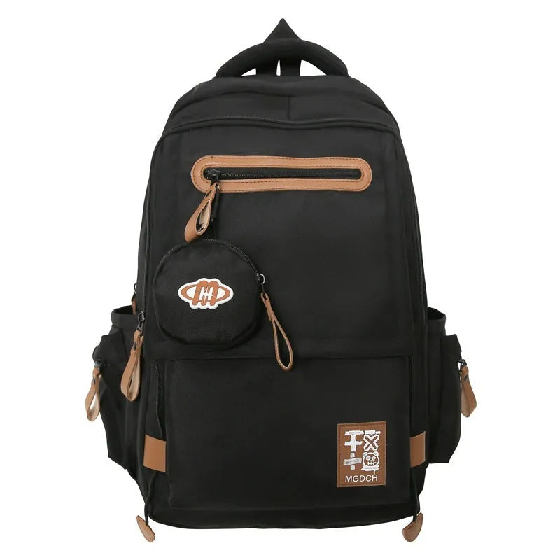 Large black nylon backpack with curved shoulder straps for middle school students