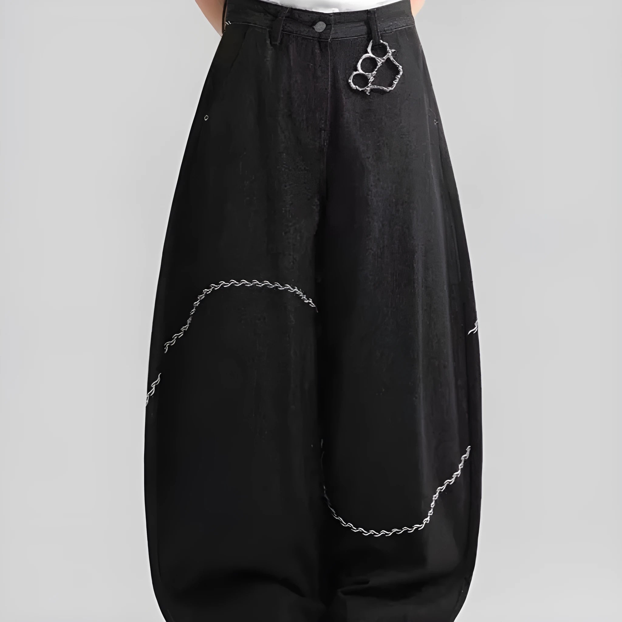 Black straight-leg denim trousers with a mid-waist and zip fly on a mannequin.