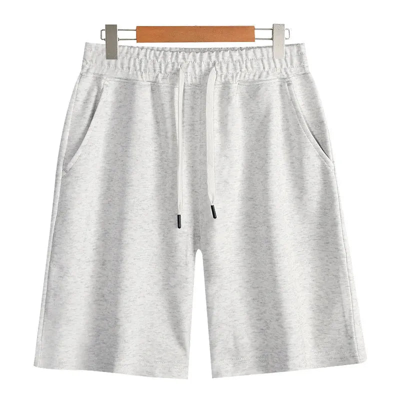 Cotton micro-elastic sports shorts in straight cut fifth length design on hanger