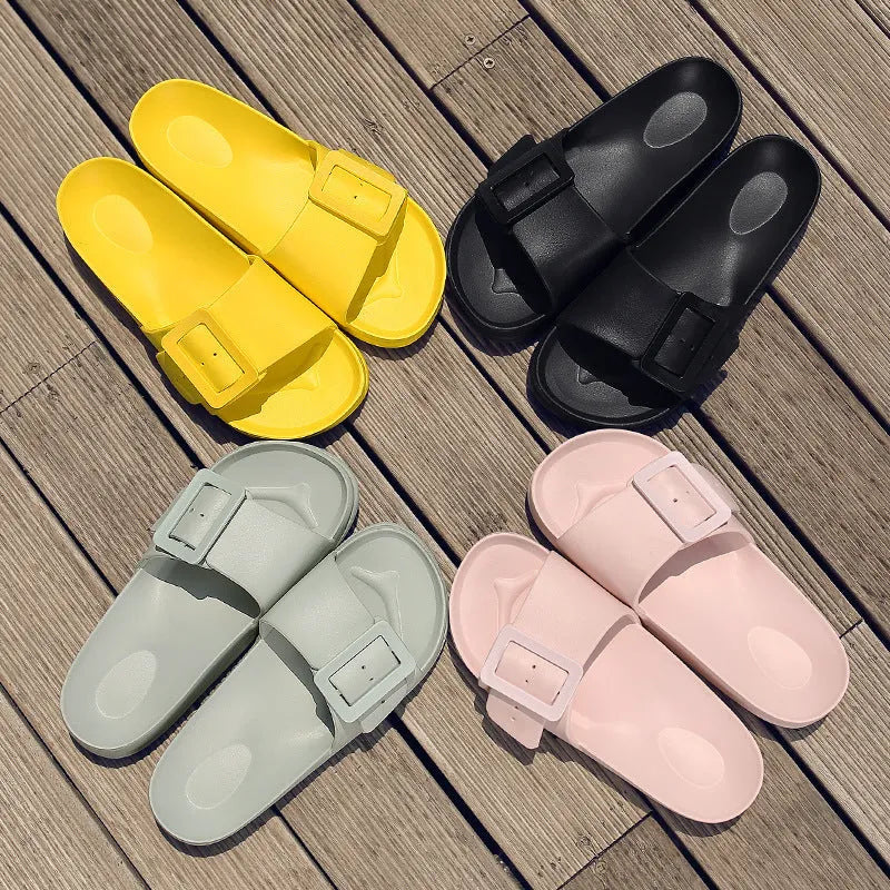 Women's grey blue buckle slippers with a flip-flop design and soft EVA sole on a white background