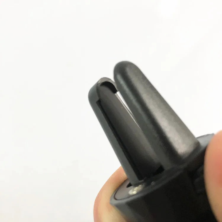 Glossy black car phone holder with air vent clip mount and adjustable smartphone cradle