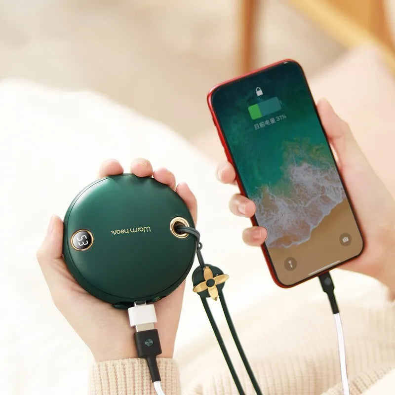 Green hand warmer power bank with digital display showing battery percentage and temperature settings