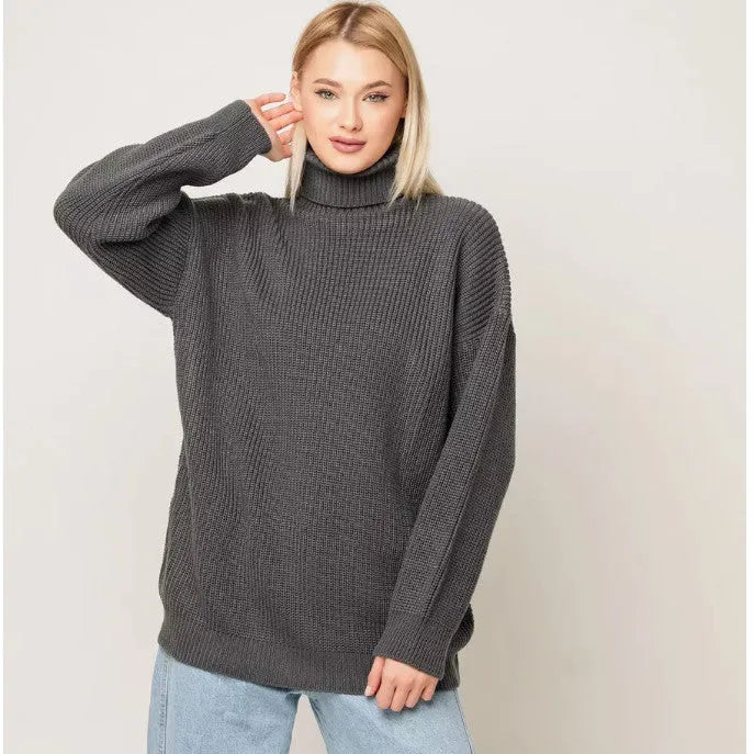 Women's solid colour high neck loose fit pullover sweater on a hanger