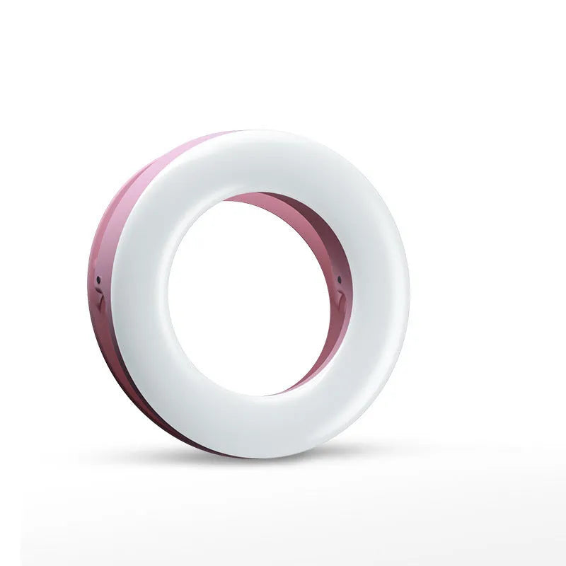 Compact black LED selfie ring light for mobile phone with USB cable for recharging.