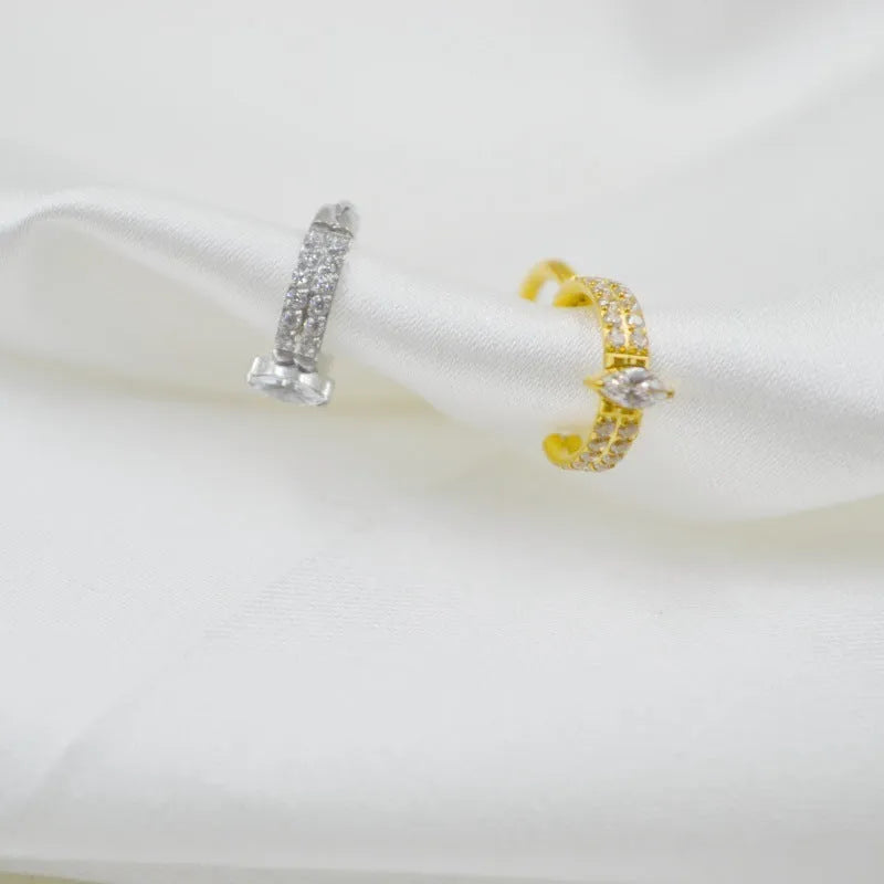 Titanium steel heart-shaped earrings with zircon stones in silver tone, showing post and butterfly back.