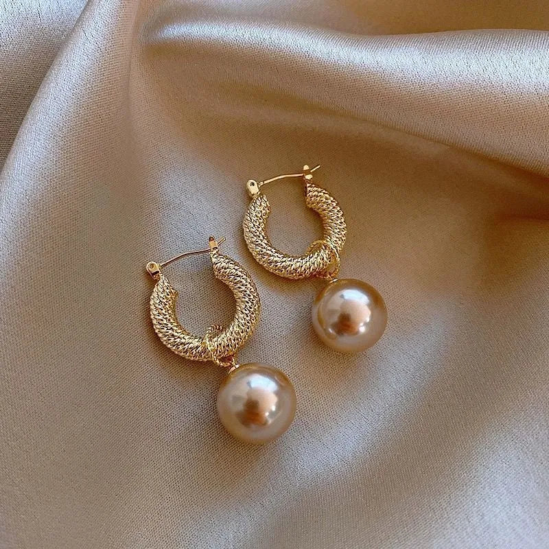 Geometric copper earrings with zircon stones in electroplated finish