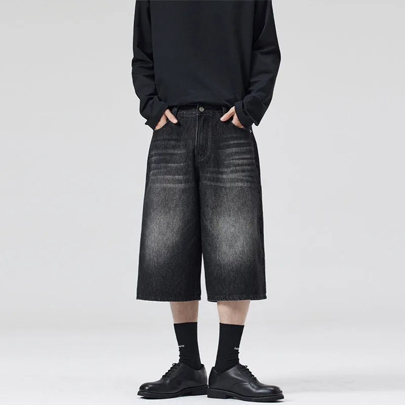 Men's straight-leg cotton denim shorts in cropped length on a casual model
