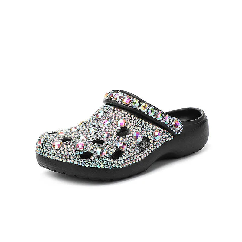 Black women's platform sandals with a hole design and rhinestone details on a lightweight EVA sole.
