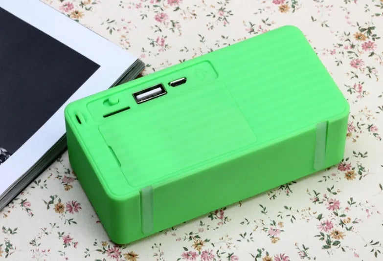 Cannon X3 cube-shaped wireless Bluetooth speaker shown in black, blue, green, red, and yellow colour options.