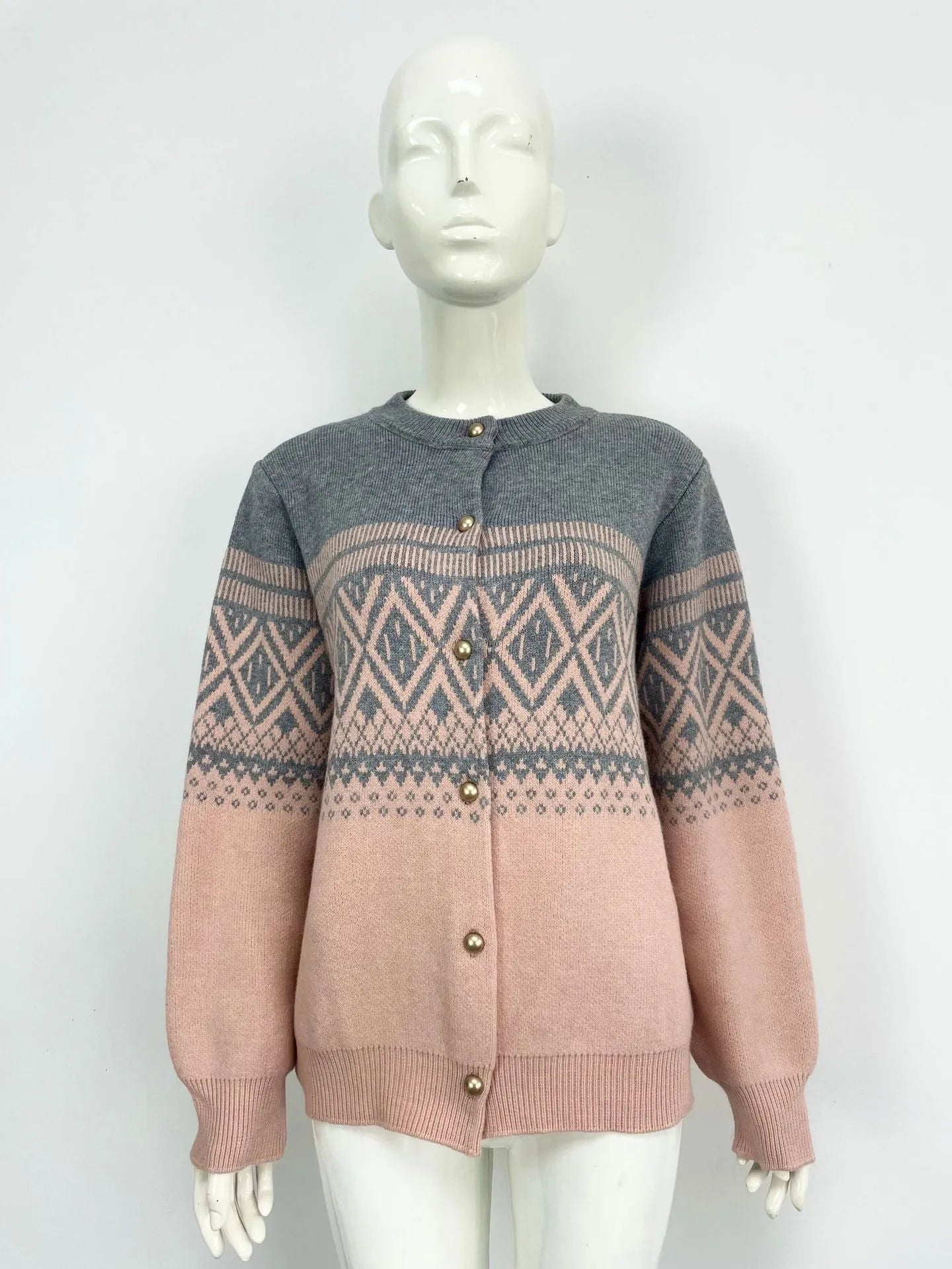 Women's grey alpaca wool cardigan with long sleeves and a red diamond contrast knit pattern.