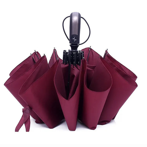 Automatic open triple folding business umbrella in black colour showing steel rib construction