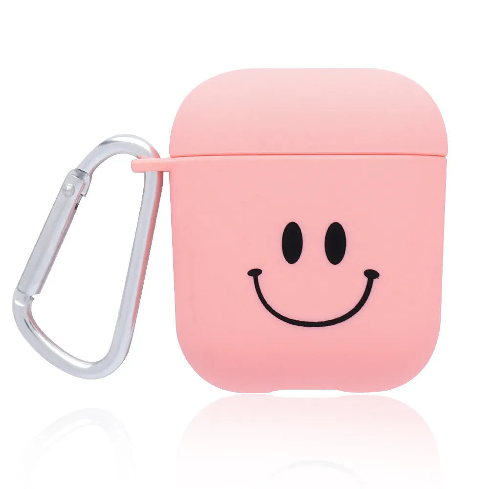 Black and pink AirPods case covers with floral and smiley face decorative patterns