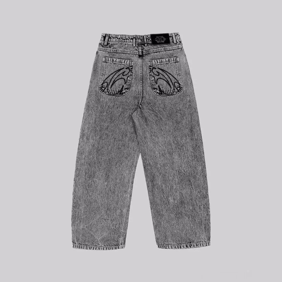 Grey loose-fit straight-leg denim trousers for men and women on a hanger.