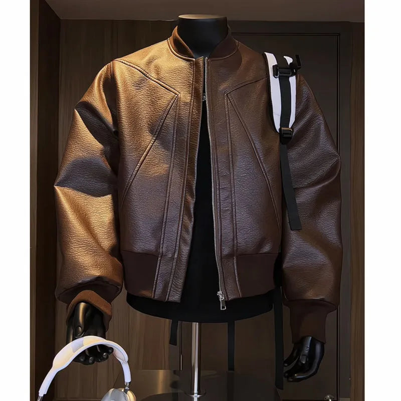 Man modelling a slim-fit black PU leather jacket with litchi grain texture and extended length.