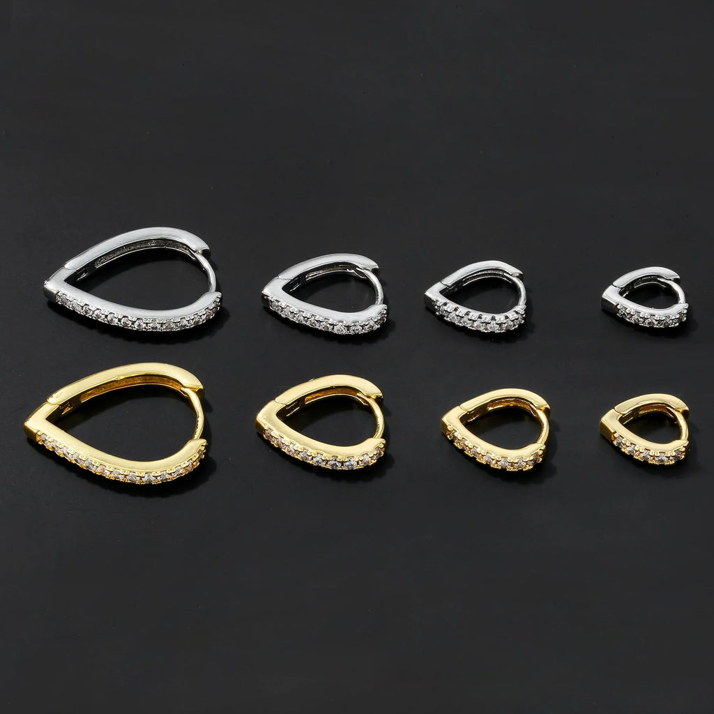 Geometric heart-shaped copper ear clip with electroplated gold finish on a white background.
