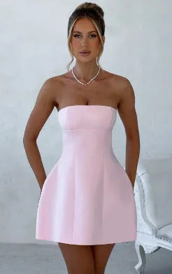 Backless slim-fit tube dress with A-line skirt in solid colour options.