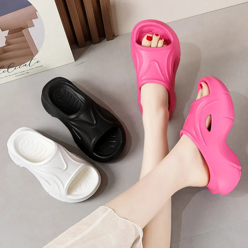 Women's thick-soled beach slippers in white, black, and rose red colours with EVA construction