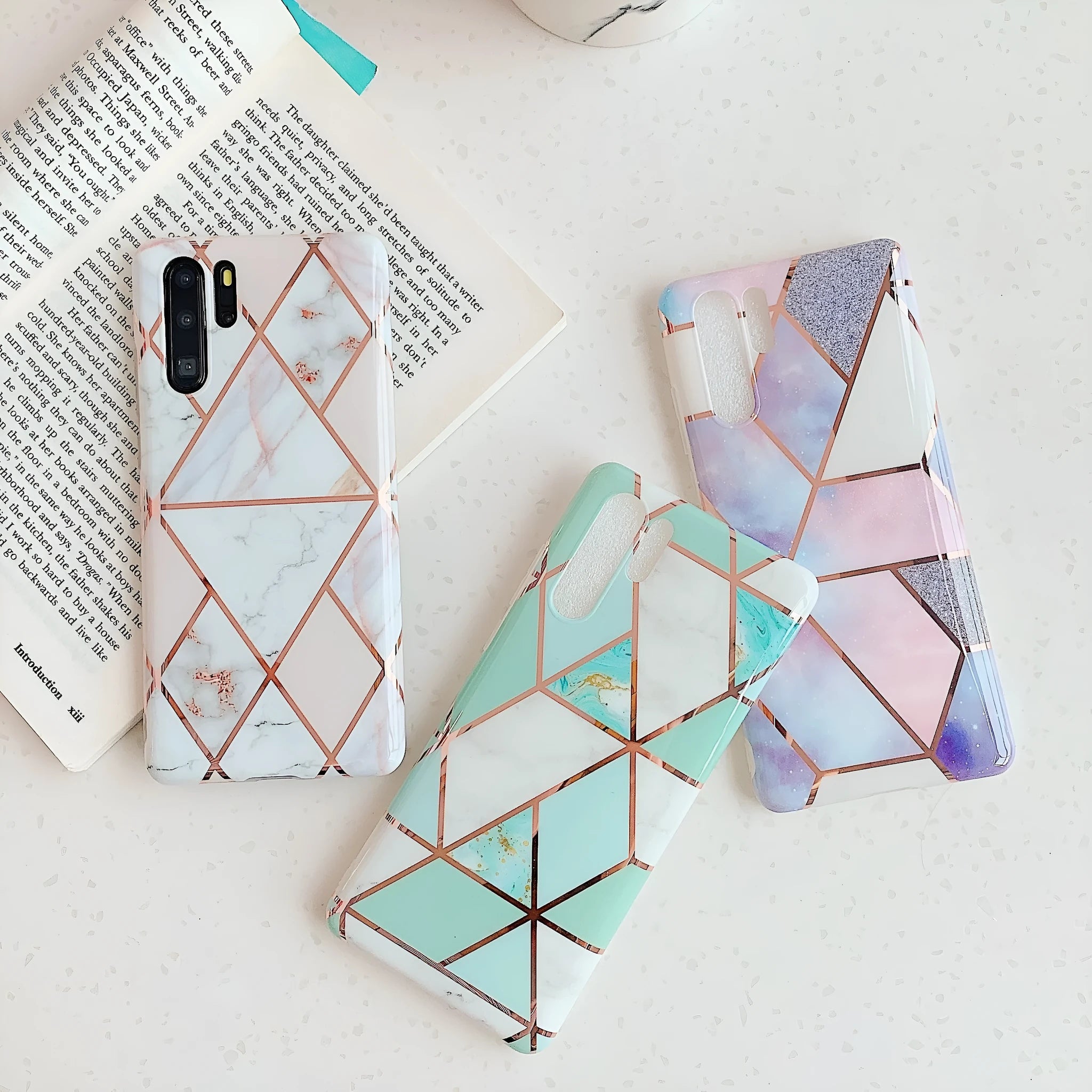 Electroplated marble pattern mobile phone case showing multiple colour options for Huawei and Samsung smartphones