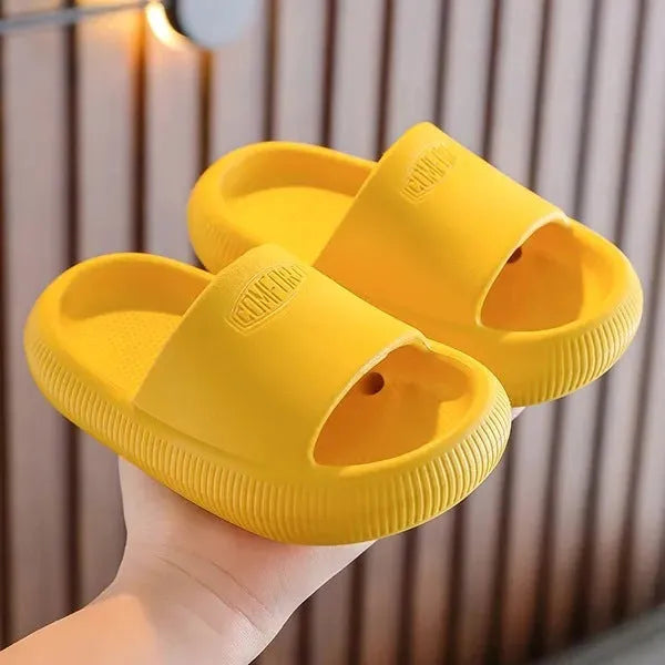 Children's mixed colour EVA slippers with non-slip soles showing size options from 15.5cm to 21.5cm