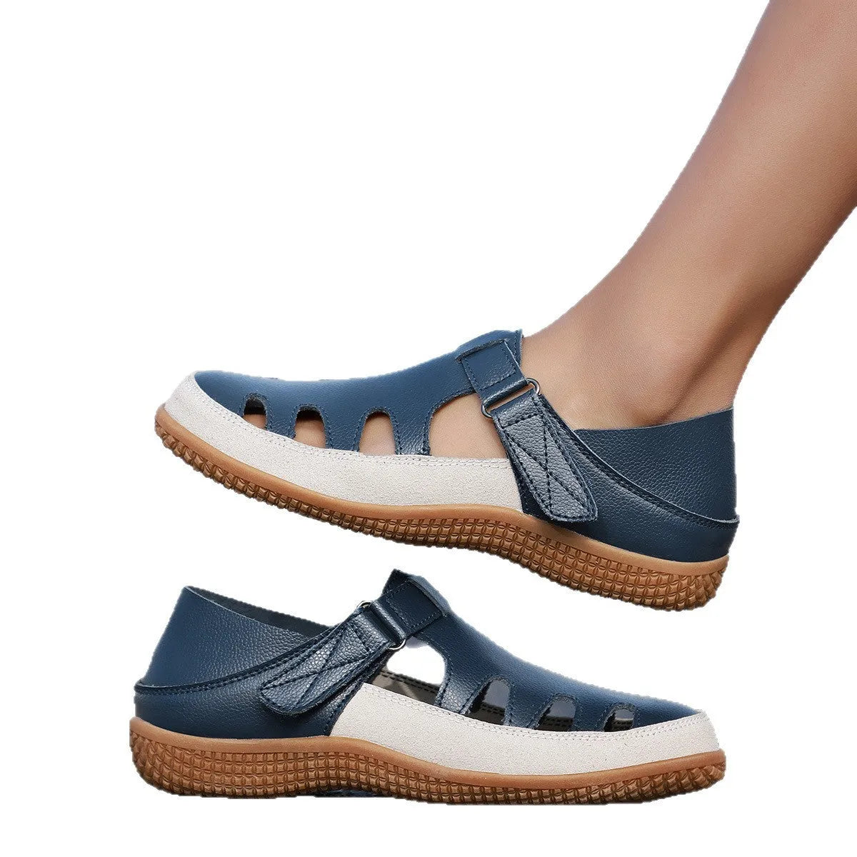 Blue plus size women's flat sandals with hollow-out design and toe cap on a thick rubber sole.