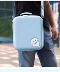 Nintendo Switch game storage bag in blue with shoulder strap and carry handle, showing game cartridge slots