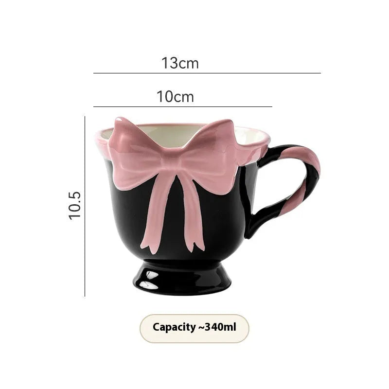 Ceramic mug with bow and heart design in white powder or black pink colours