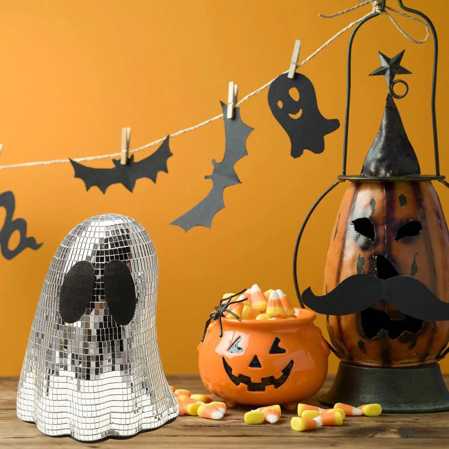 Silver Halloween ghost decoration with glass mosaic mirror patch design on dark surface