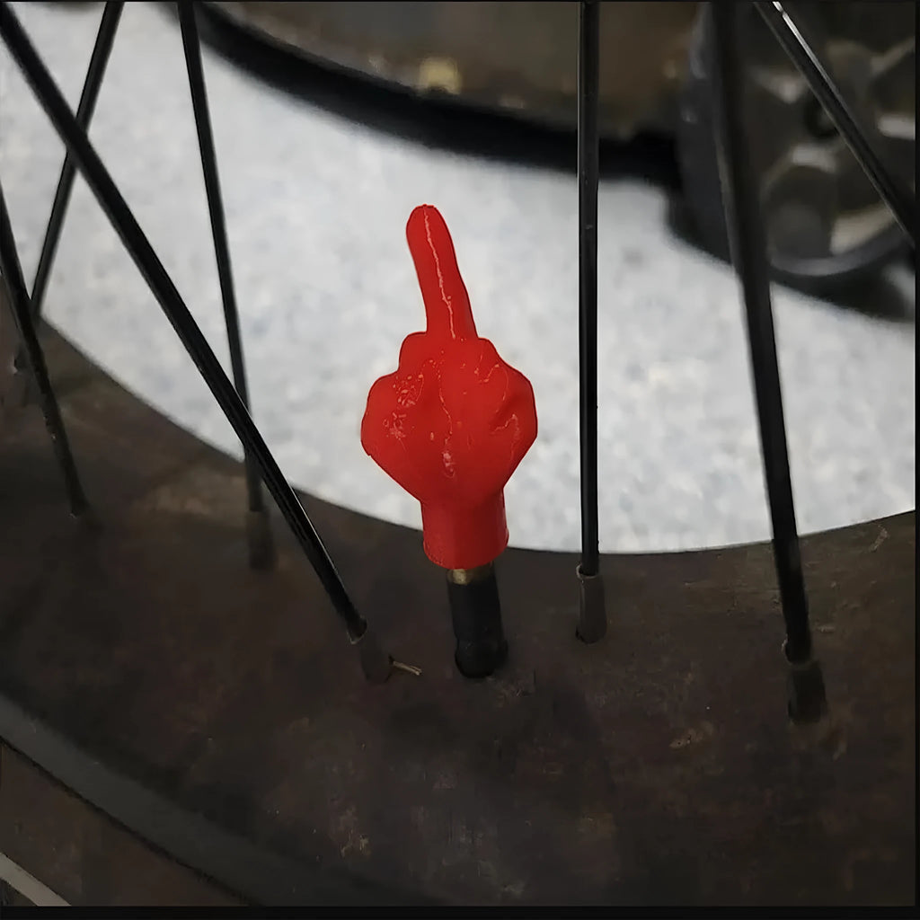 Four latex car tyre valve dust caps shown in black and skin colour options