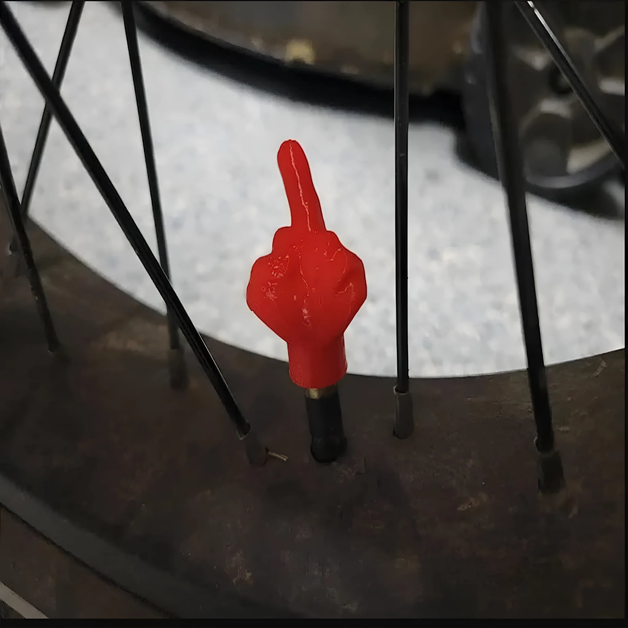Four latex car tyre valve dust caps shown in black and skin colour options