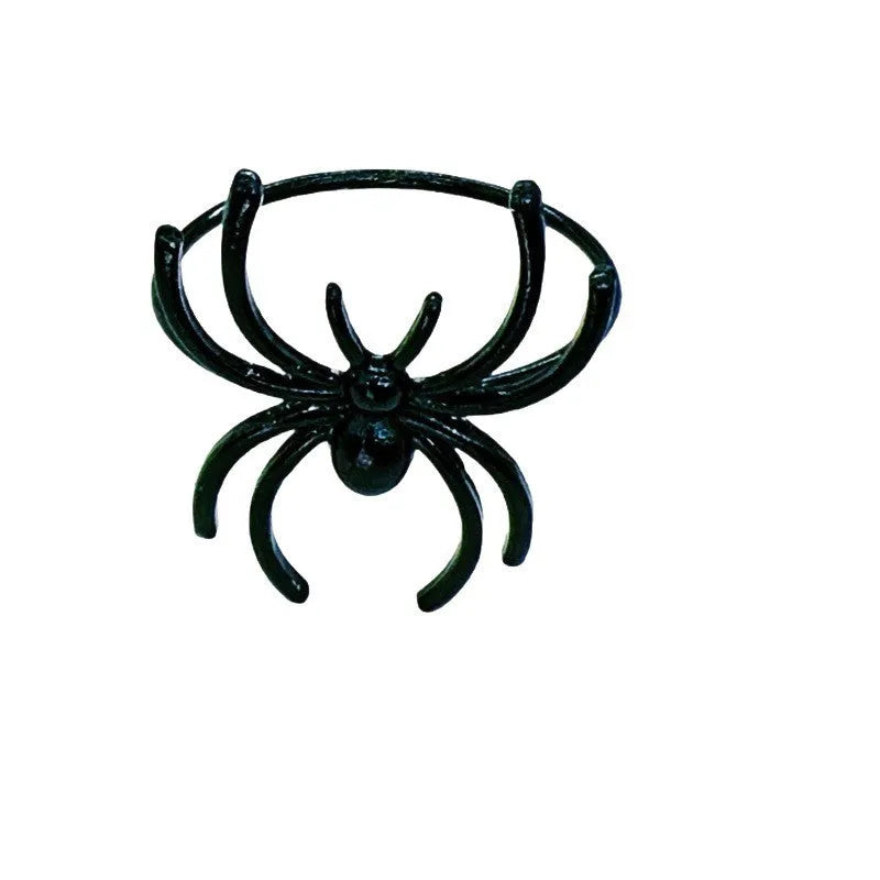 Set of six black alloy spider-shaped napkin rings for Halloween table decoration