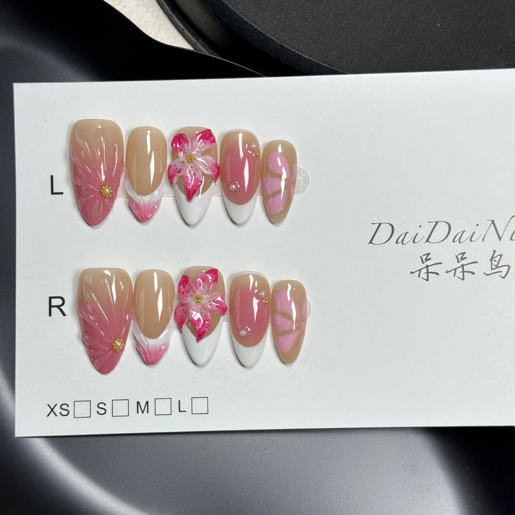 French style three-dimensional lily ice flower gel nail stickers in almond shape on plastic backing.