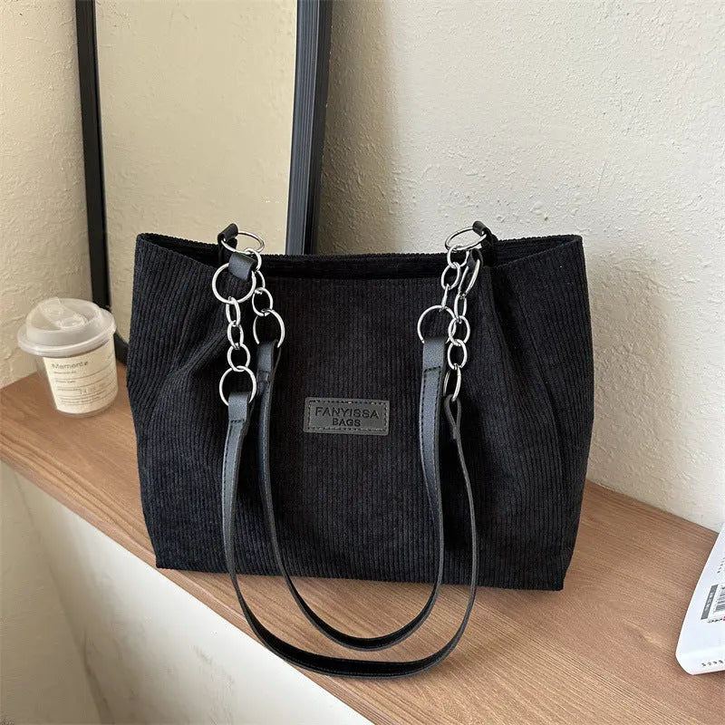 Corduroy one-shoulder tote handbag in street style with three-dimensional pocket