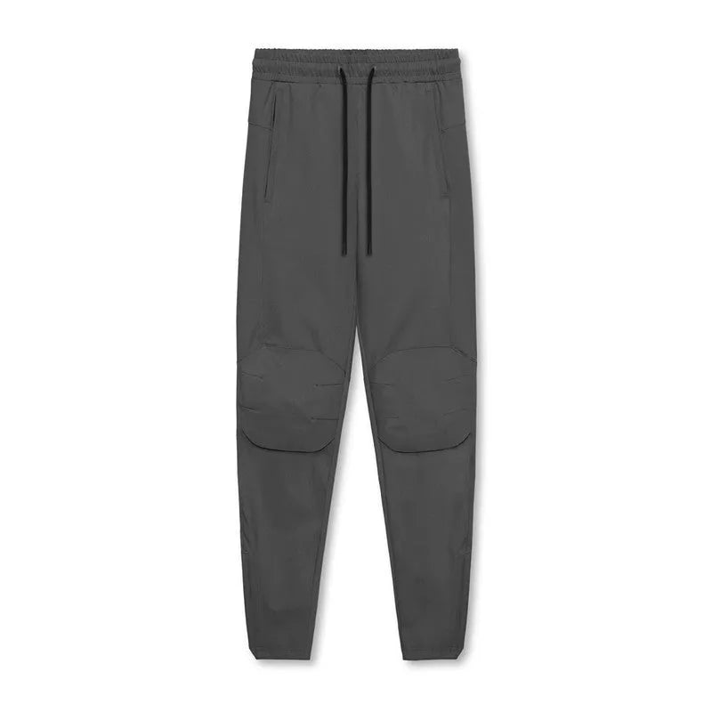 Men's loose grey quick-dry fitness trousers with ankle-tied cuffs for running and gym workouts