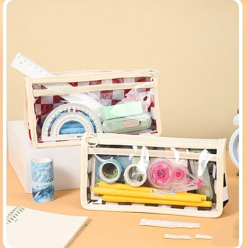 Transparent PVC pencil case with chessboard pattern showing pens inside, black and white grid design