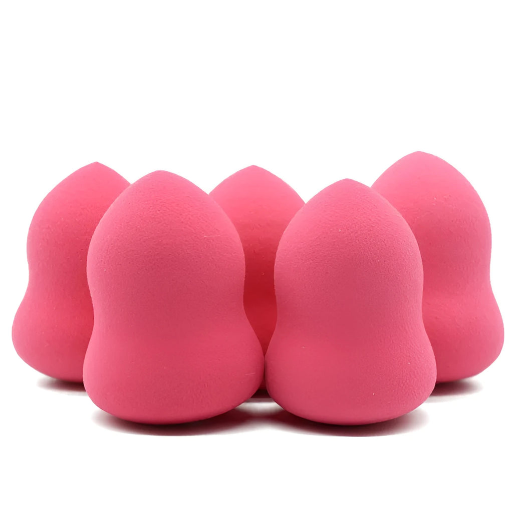 Pink non-latex makeup foundation sponge shown next to a ruler showing 4 cm width and 5.6 cm height