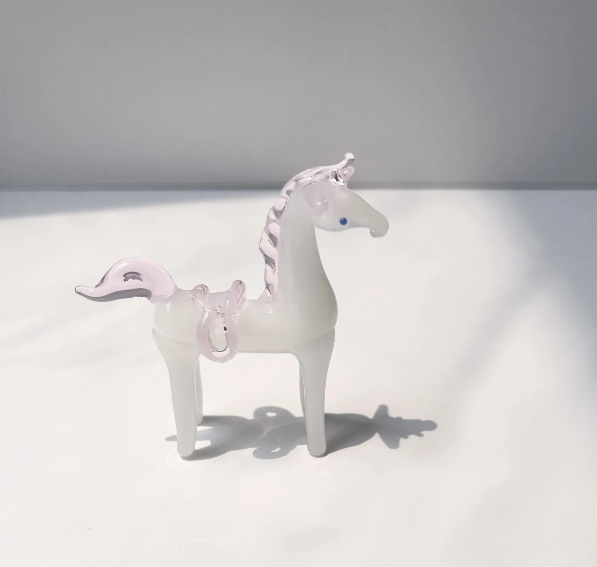 Brown coloured glaze horse decoration on wooden desk