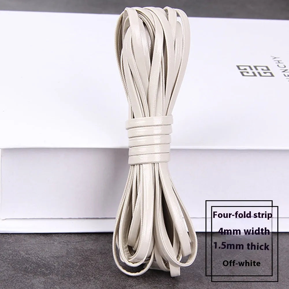 Coils of PU leather craft cord in multiple colours including black, red, blue, and beige
