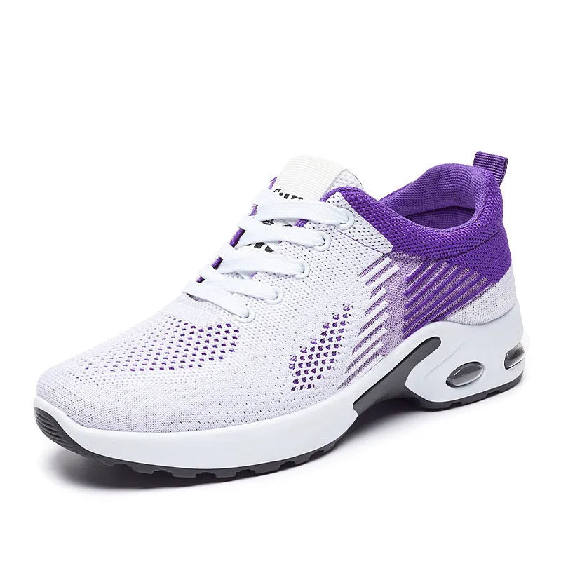 Women's Flyknit casual running shoes in striped pattern with lace-up front, shown in pink colour.