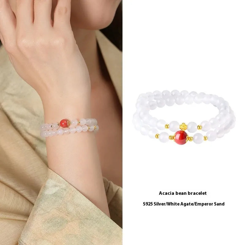 White agate bracelet with jequirity bean and cinnabar beads, 6mm polished geometric shape