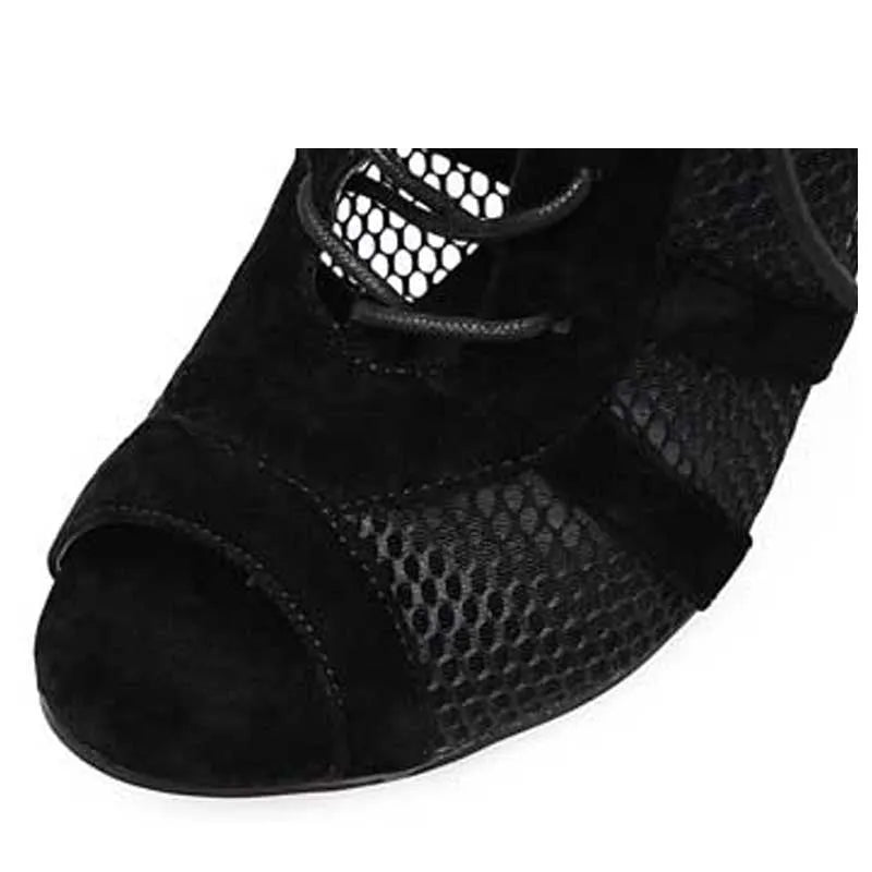 Black suede women's lace-up high heel shoes with a high stiletto heel on a plain background