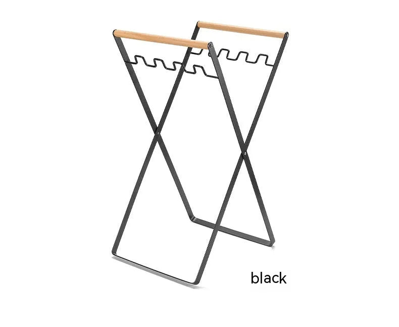 Black iron folding trash storage rack with wooden carrying handles
