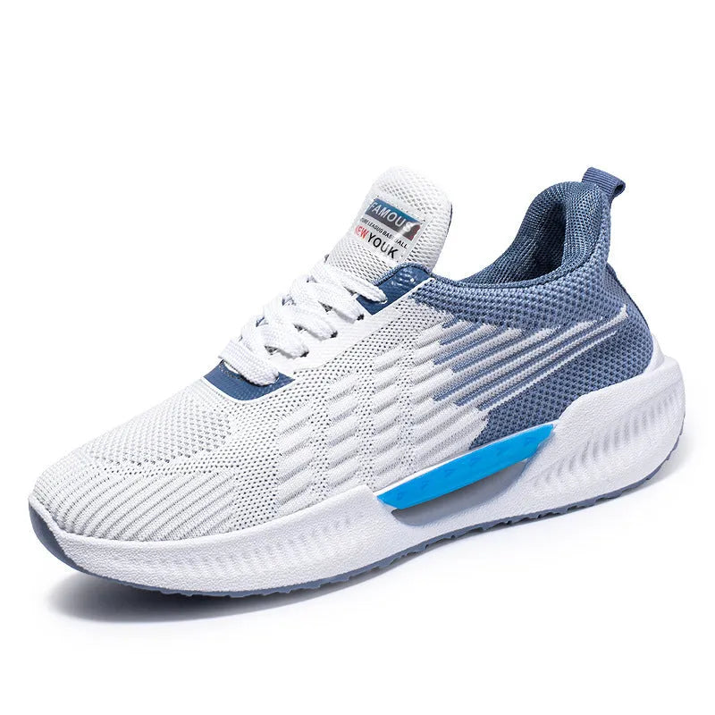 Men's blue mesh sports shoes with round toe and plastic sole on a grey background.