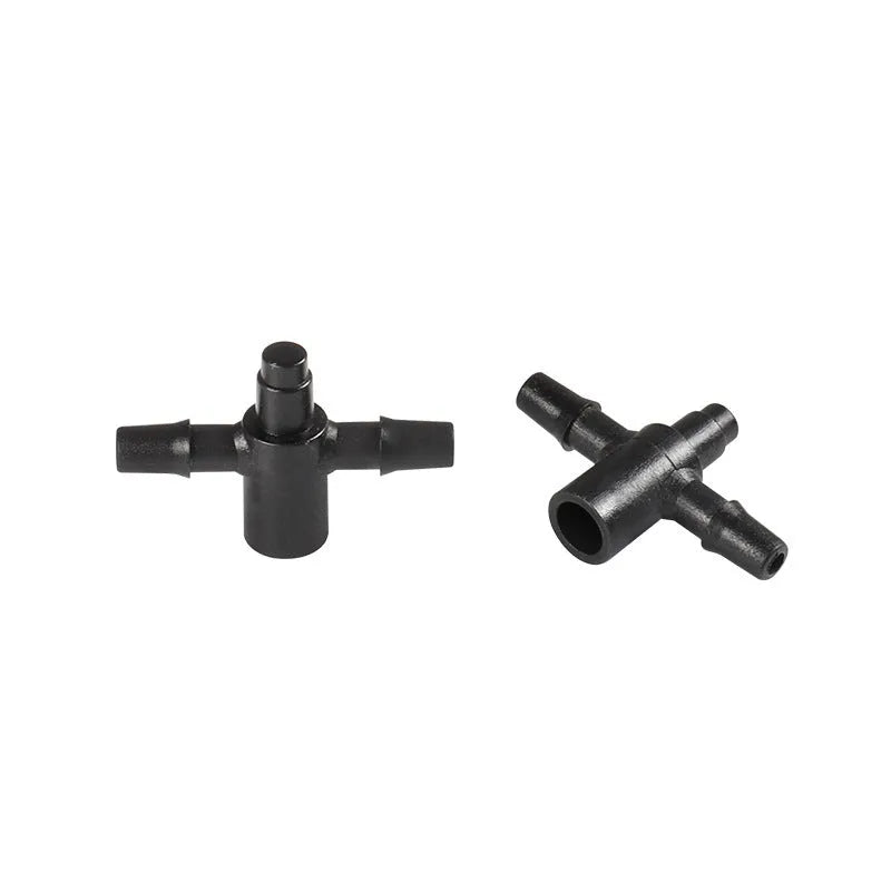 White PE plastic tee water distributor joint for micro spray garden irrigation systems.