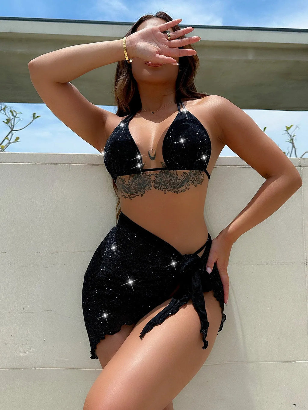 Black three-piece bikini swimsuit set with matching top and shorts on Asian sizing mannequin