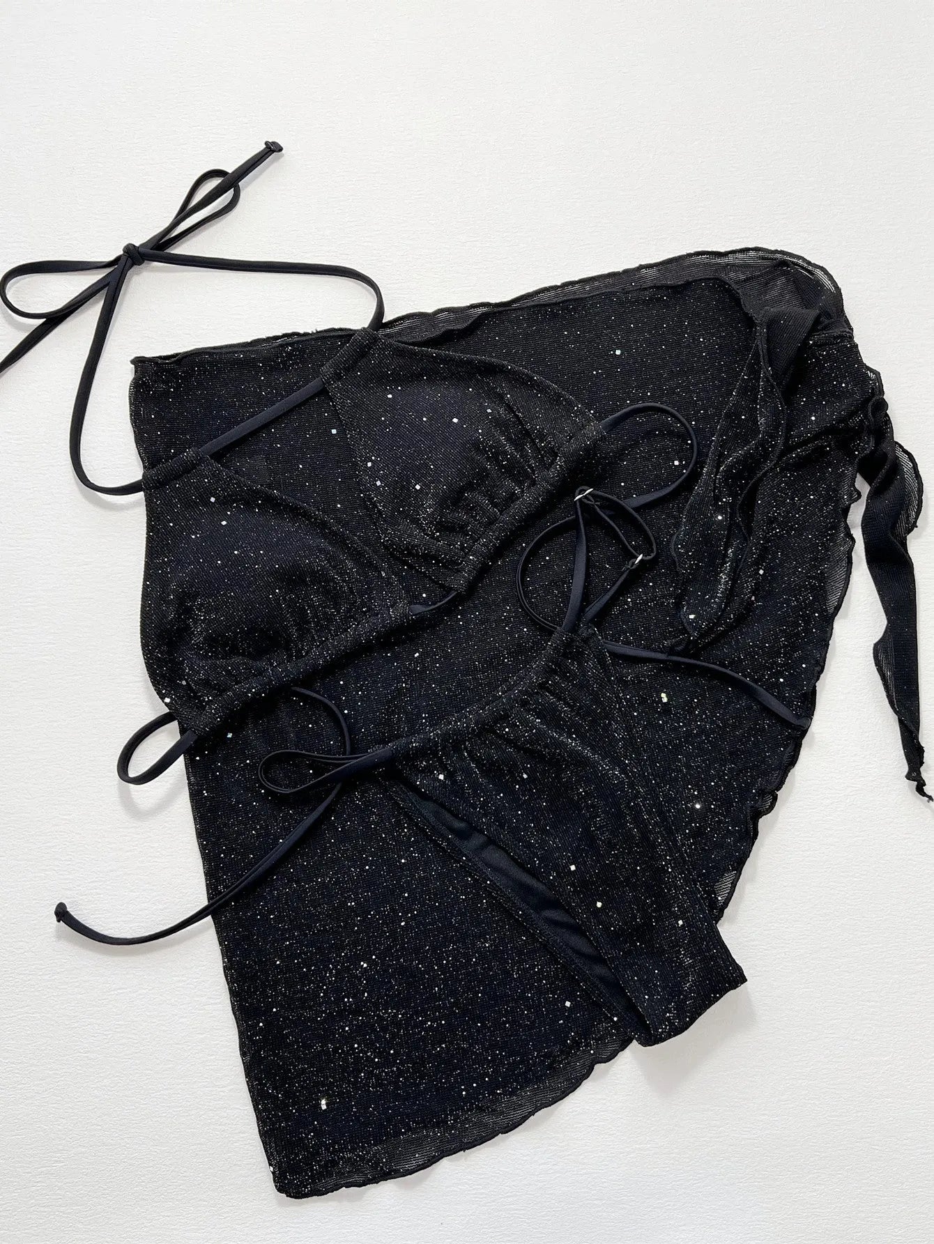 Black three-piece bikini swimsuit set with matching top and shorts on Asian sizing mannequin